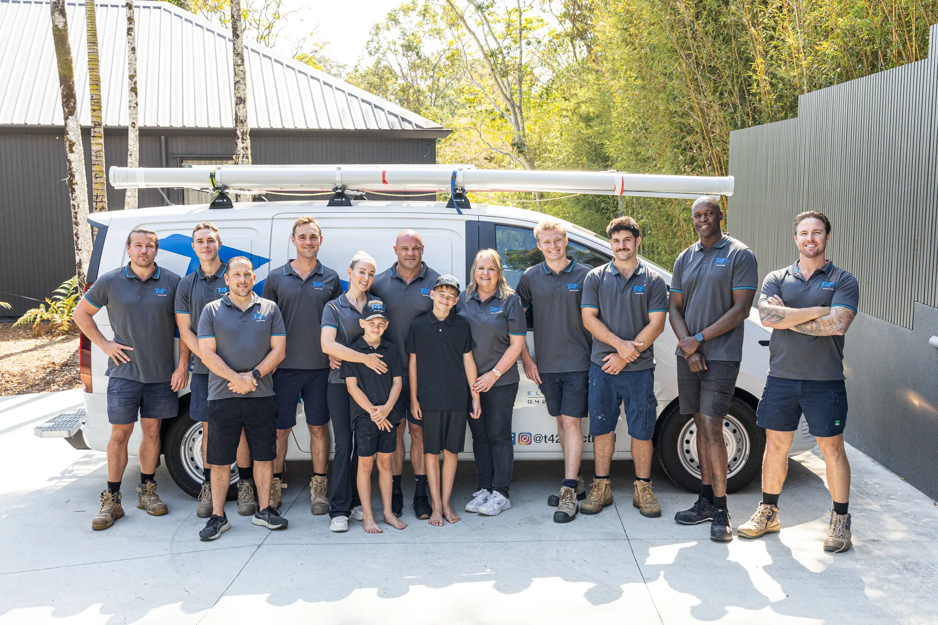 The team and family with the service van